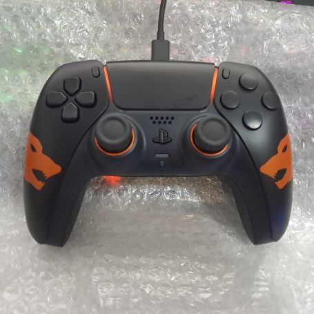 A customised orange game controller featuring "Call of Duty: Black Ops" design.