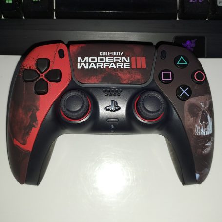 A customised red game controller featuring "Call of Duty: Black Ops" design.